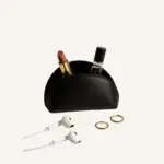 Grace bags smallest piece for stuff organization. Its a D shaped small pouch in black color.